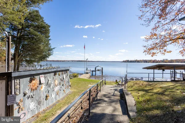 a view of swimming pool with outdoor seating