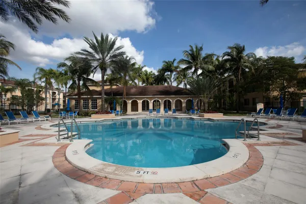 a view of a swimming pool with a sitting space