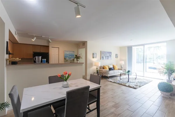 a view of a dining room with furniture and a livingroom