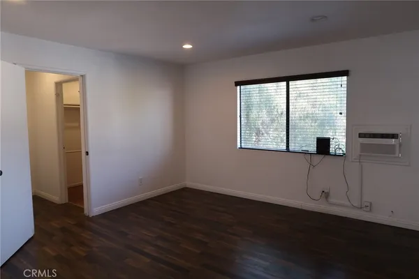 a view of hallway with wooden floor