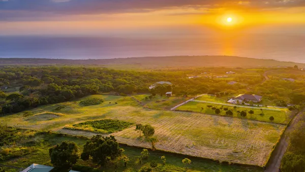 a view of an ocean and a mountain