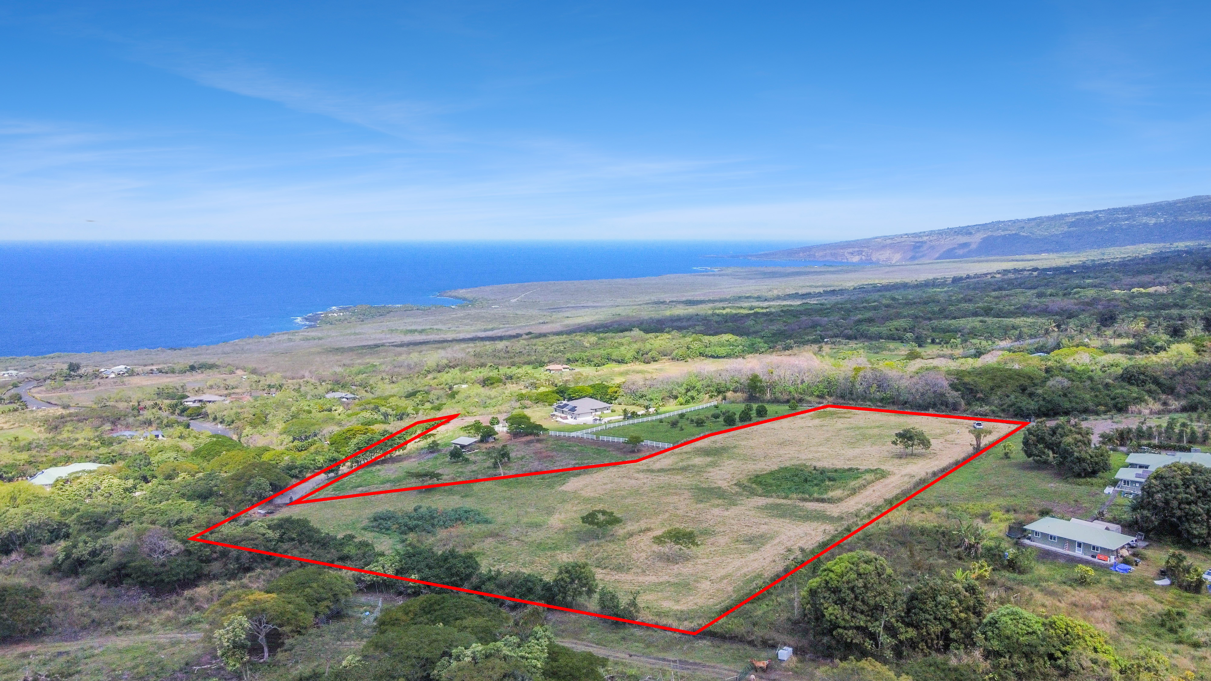 85-5195 Kiilae Road Captain Cook, HI 96704 - Photo 16 of 20 an aerial view of ocean and residential houses with outdoor space