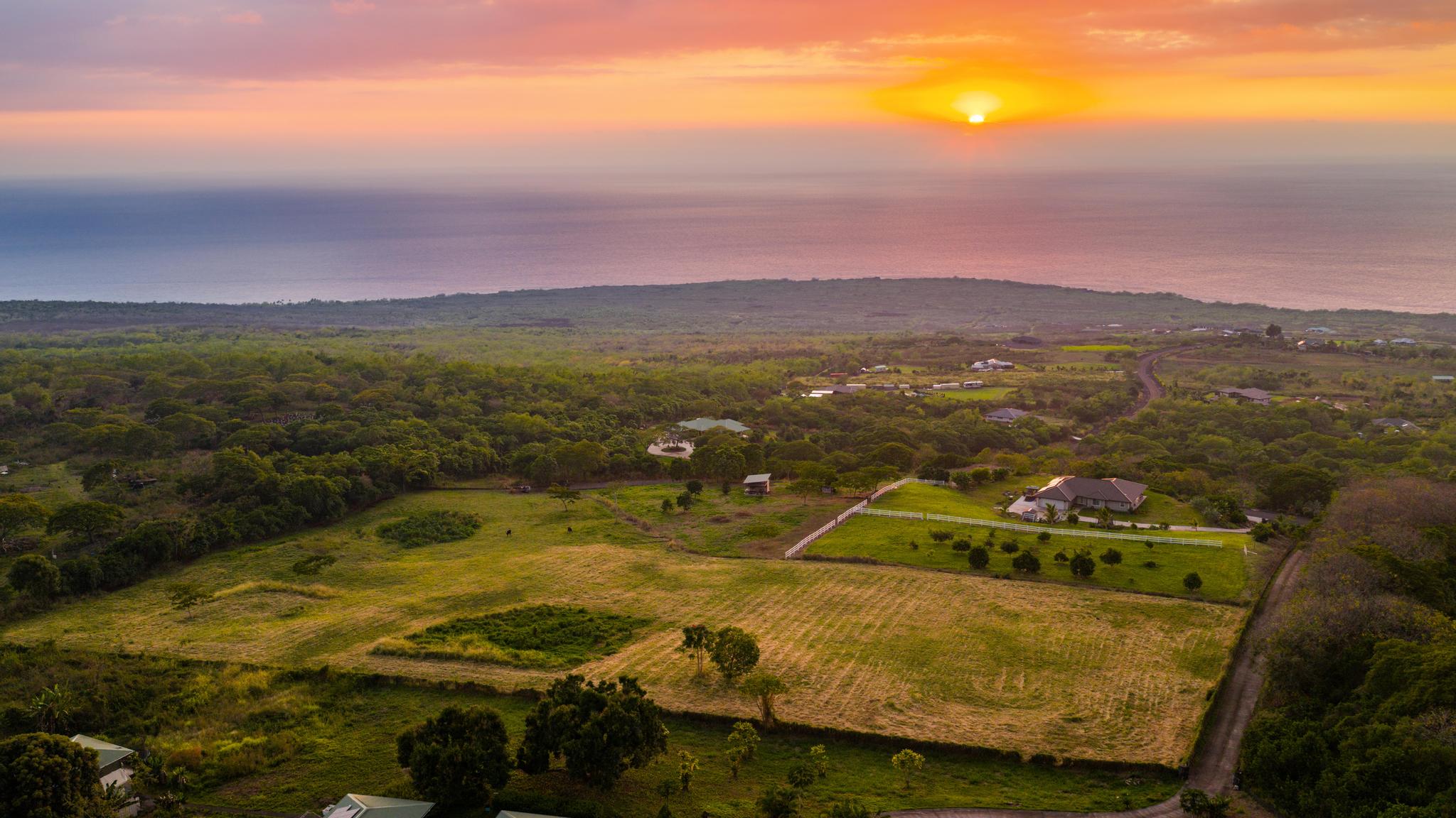 85-5195 Kiilae Road Captain Cook, HI 96704 - Photo 2 of 20 a view of a lake with a mountain
