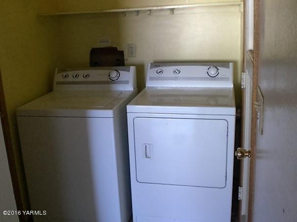 131 Webert Road Tieton, WA 98947 - Photo 16 of 17 a utility room with dryer and washer