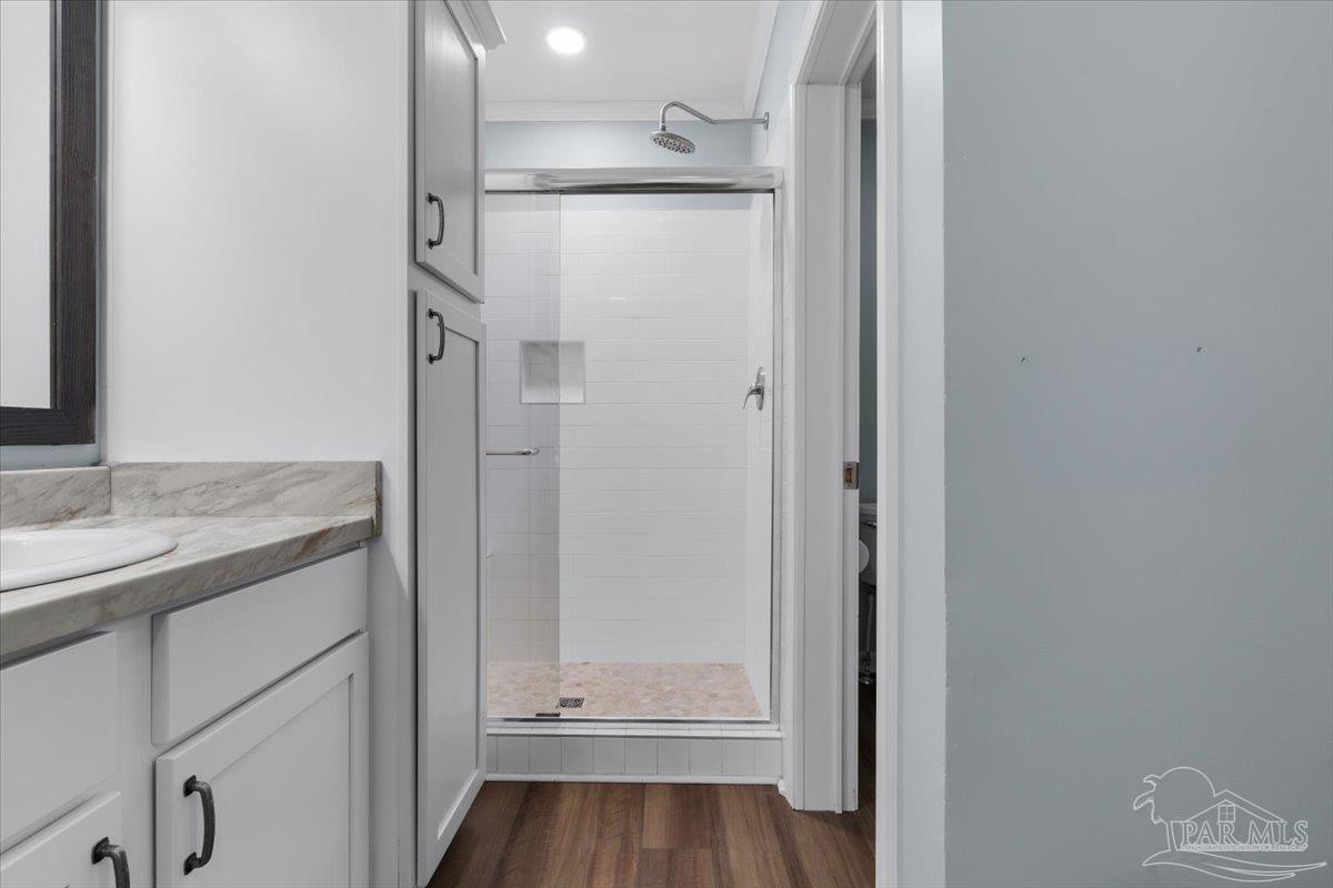 4955 Blue Ribbon Drive Milton, FL 32583 - Photo 13 of 32 a bathroom with a shower and a sink