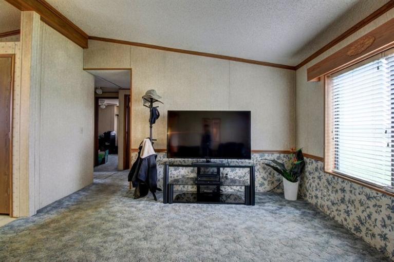 8085 High Banks Road Central Point, OR 97502 - Photo 15 of 35 a living room with furniture and a flat screen tv