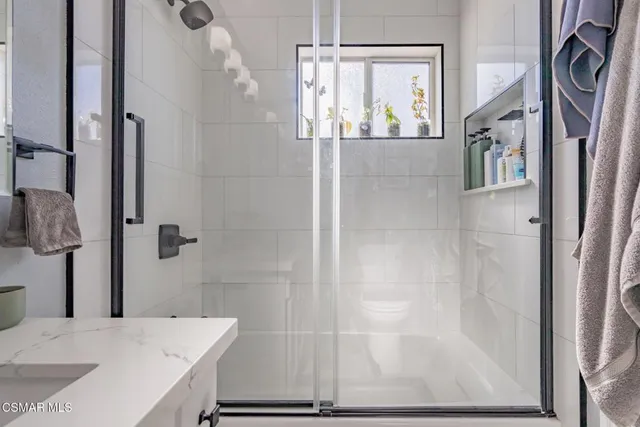 a view of a room with furniture and a large window