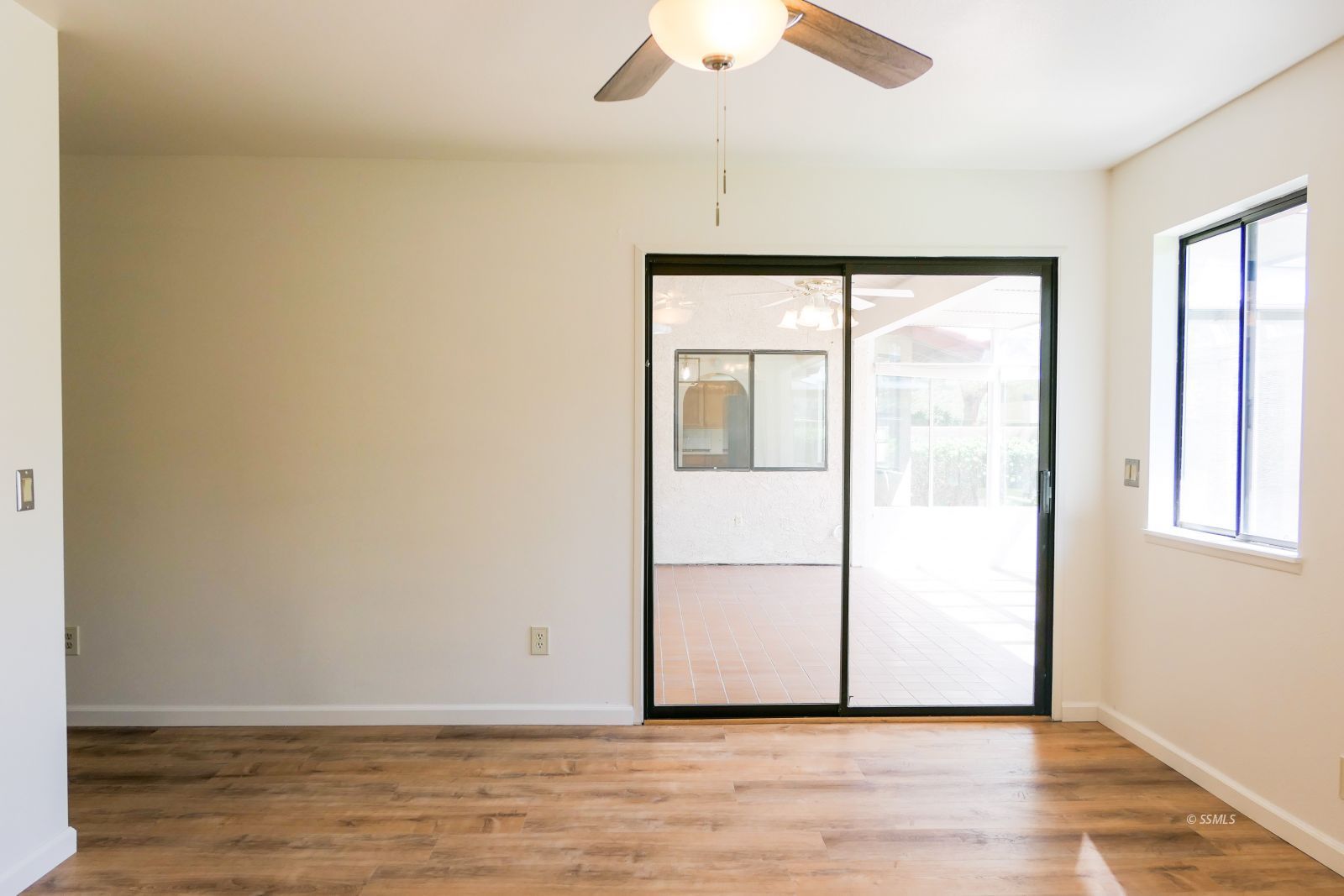 925 Hermosa Avenue Ridgecrest, CA 93555 - Photo 25 of 50 an empty room with wooden floor and windows