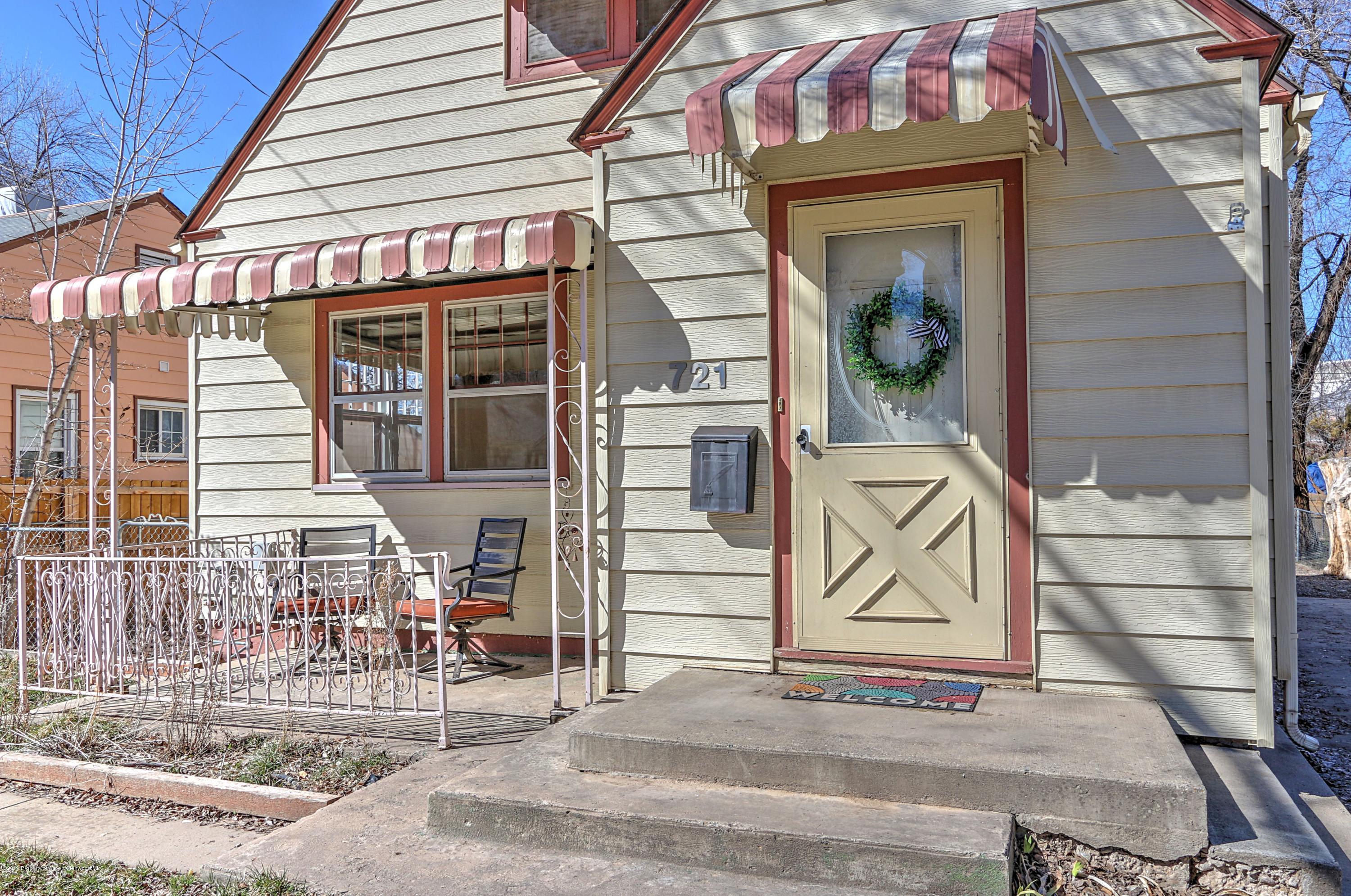 721 East Avenue Rifle, CO 81650 - Photo 2 of 24 a front view of a house with a door