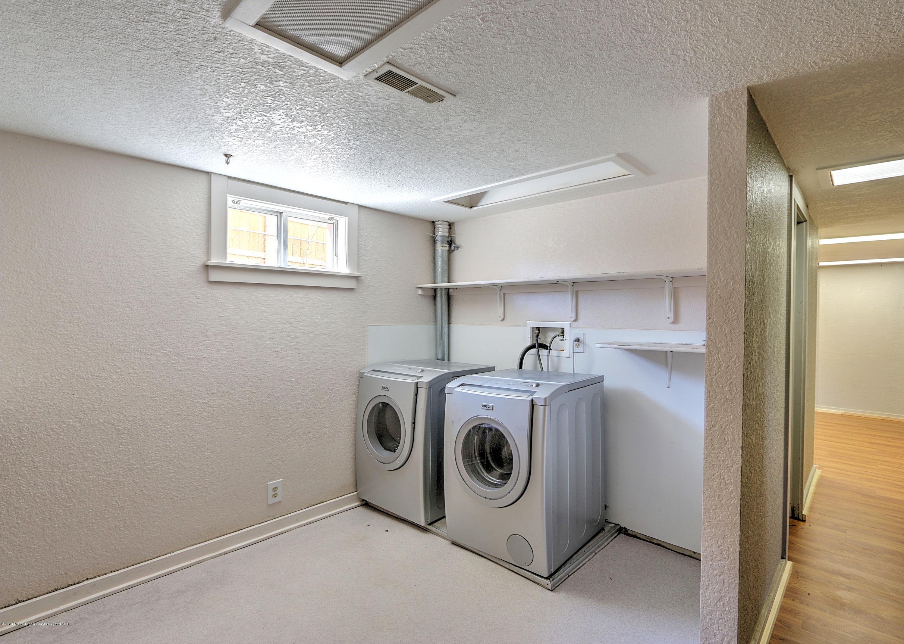 721 East Avenue Rifle, CO 81650 - Photo 22 of 24 a utility room with dryer and washer