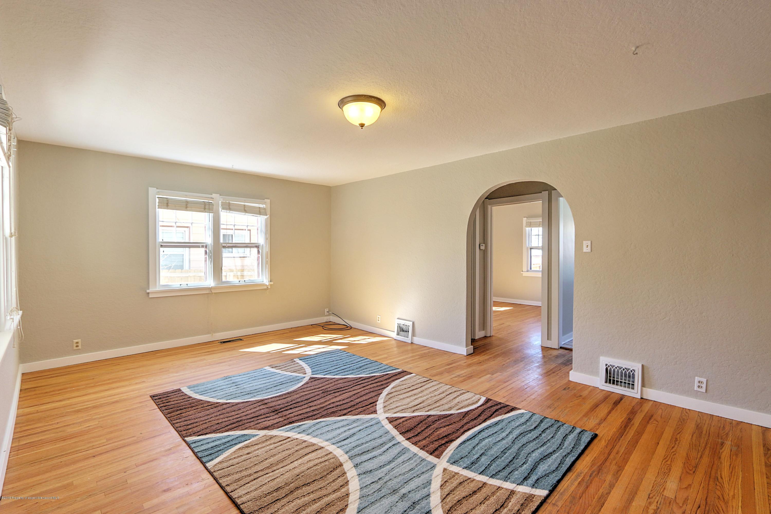 721 East Avenue Rifle, CO 81650 - Photo 6 of 24 a bedroom with a bed and a window