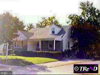 110 Locust Road Morton, PA 19070 - Photo 1 of 1 a view of a house with swimming pool and a yard