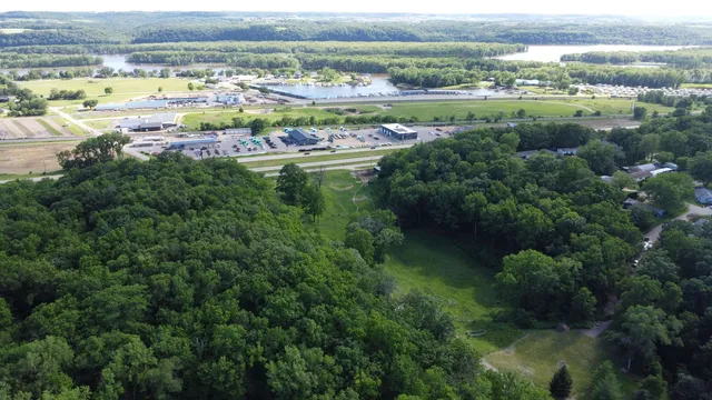 an aerial view of a houses with outdoor space and city view