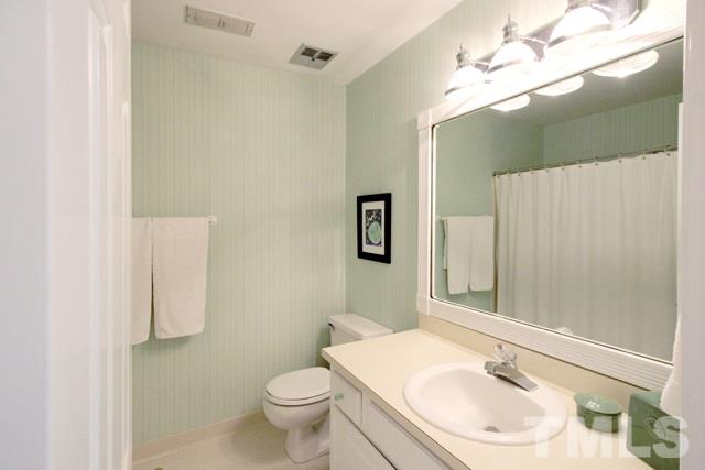 4440 Oak Park Road Raleigh, NC 27612 - Photo 20 of 25 Half bath for guests conveniently located on first floor.