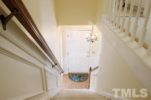 4440 Oak Park Road Raleigh, NC 27612 - Photo 4 of 25 Staircase with view of entrance to dining room.