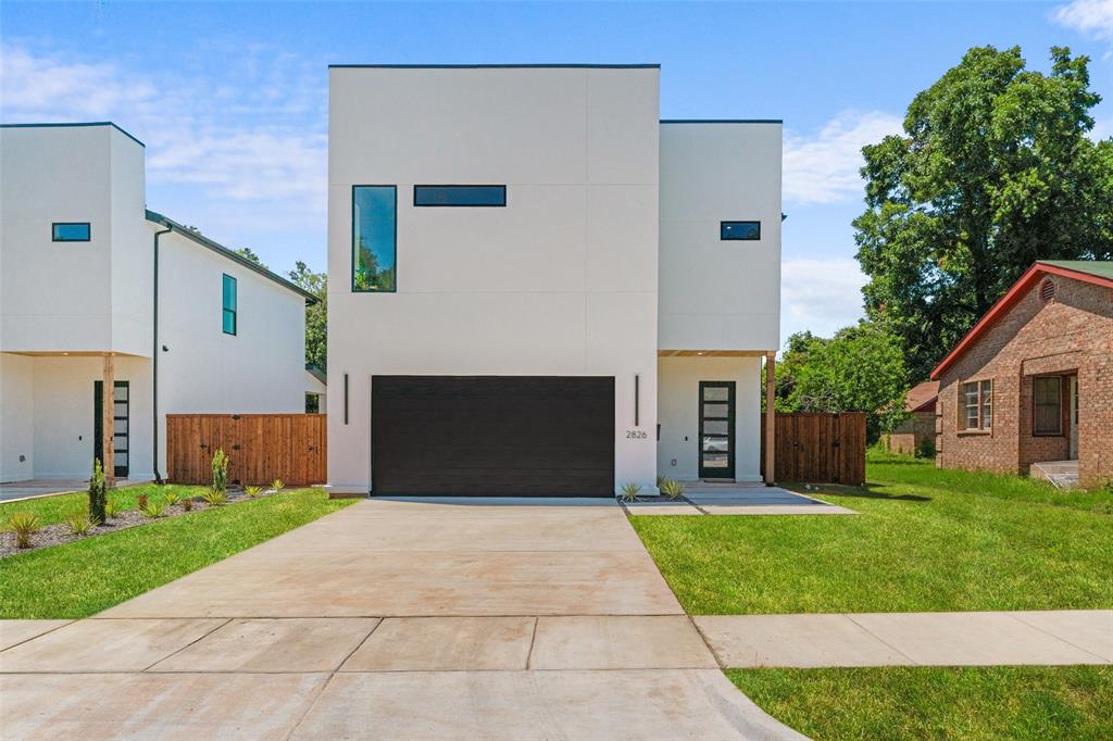 2826 Rochester Street Dallas, TX 75215 - Photo 1 of 38 Contemporary house featuring stucco siding, concrete driveway, and a garage