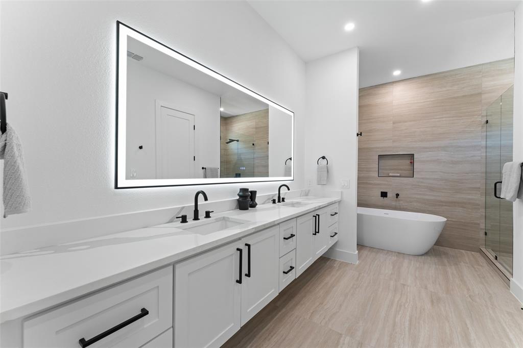 2826 Rochester Street Dallas, TX 75215 - Photo 18 of 38 Full bathroom with double vanity, a shower stall, a soaking tub, and recessed lighting