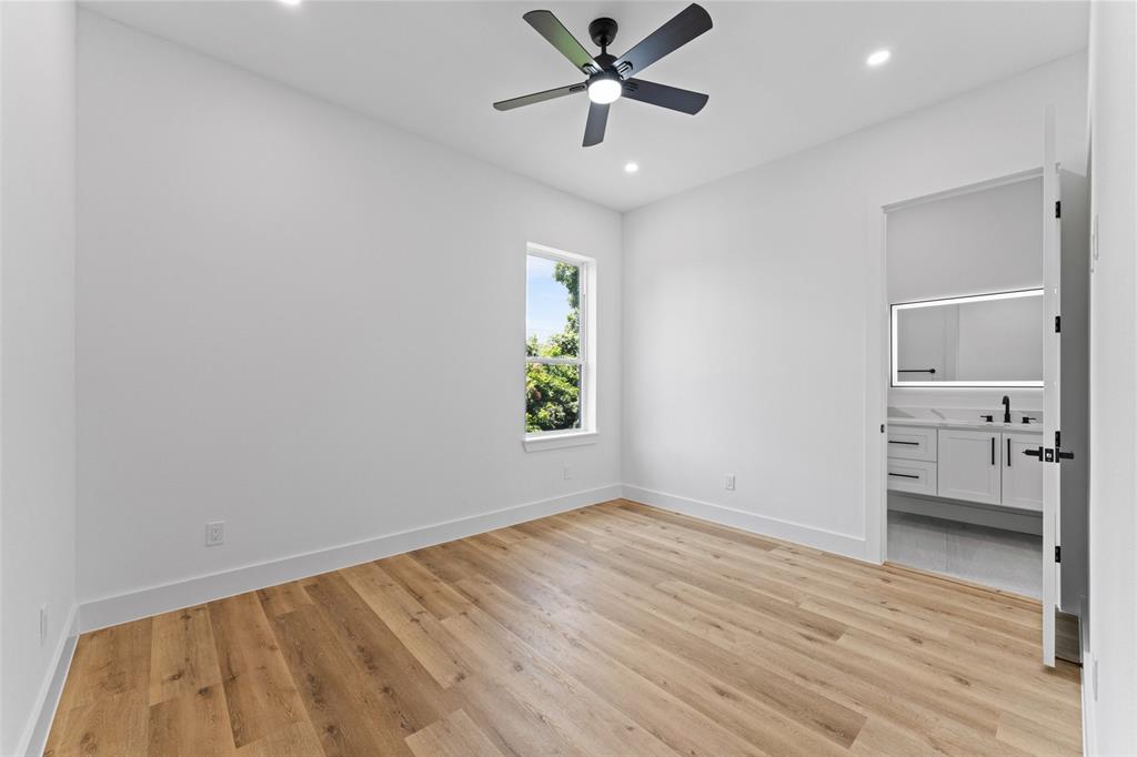2826 Rochester Street Dallas, TX 75215 - Photo 24 of 38 Unfurnished bedroom featuring light wood-style floors, a ceiling fan, ensuite bath, and recessed lighting