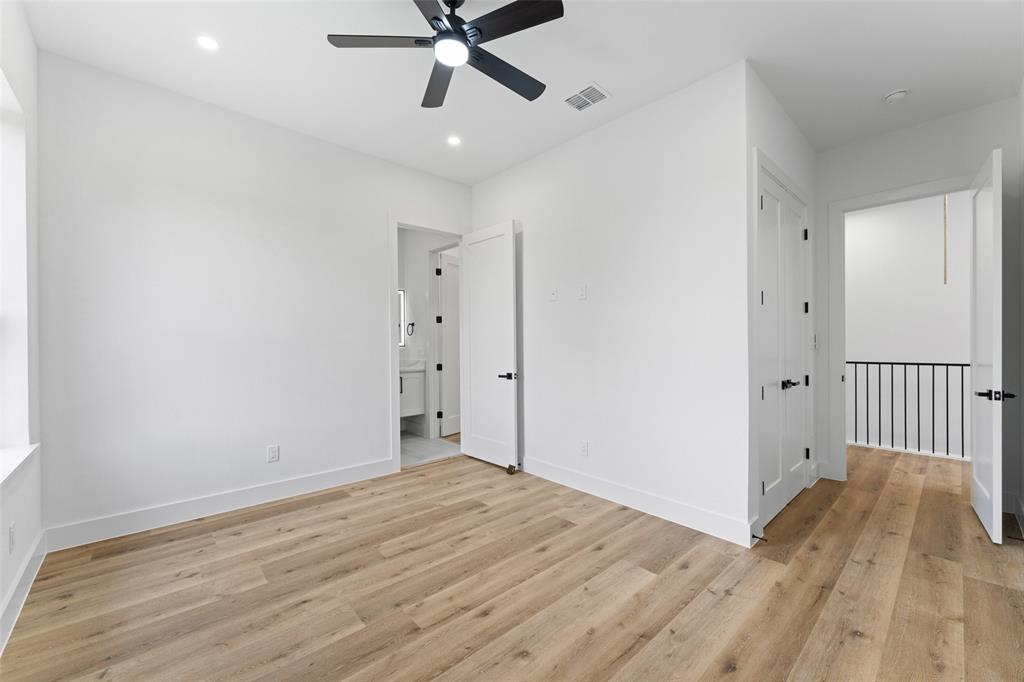 2826 Rochester Street Dallas, TX 75215 - Photo 25 of 38 Unfurnished bedroom with light wood finished floors, a ceiling fan, and recessed lighting