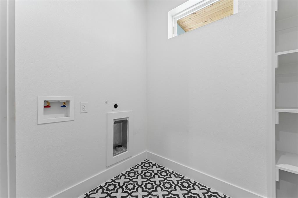 2826 Rochester Street Dallas, TX 75215 - Photo 30 of 38 Laundry room with electric dryer hookup, hookup for a washing machine, and tile patterned floors