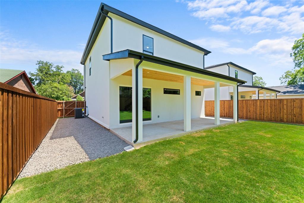 2826 Rochester Street Dallas, TX 75215 - Photo 32 of 38 Back of house with a patio area, a fenced backyard, and stucco siding