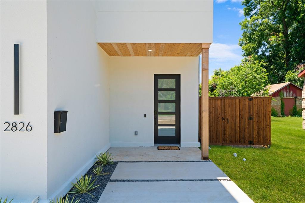 2826 Rochester Street Dallas, TX 75215 - Photo 4 of 38 Doorway to property featuring stucco siding and a porch