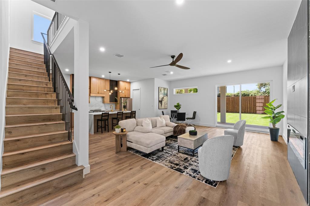 2826 Rochester Street Dallas, TX 75215 - Photo 6 of 38 Living room with stairs, light wood finished floors, ceiling fan, and recessed lighting