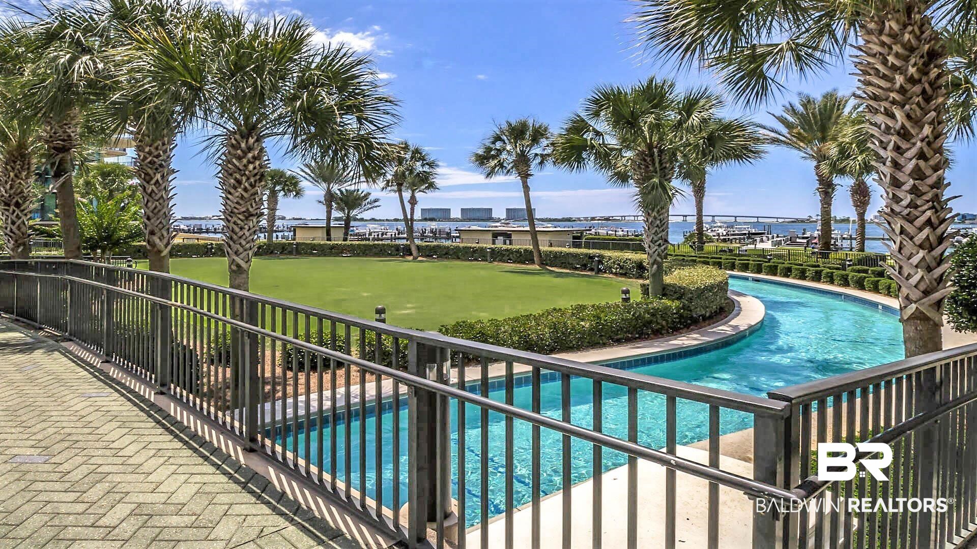 27580 Canal Road, Unit 1431 Orange Beach, AL 36561 - Photo 52 of 73 View of pool featuring an area to practice putting and a patio area