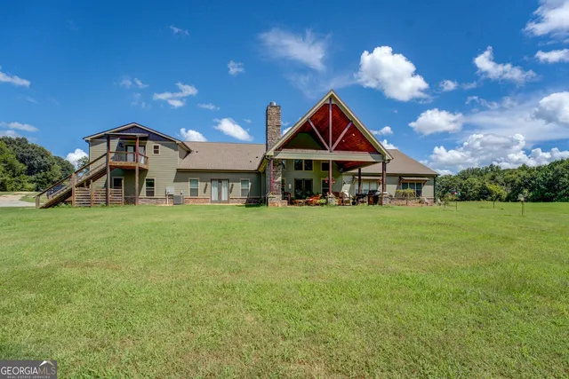 a view of a swimming pool with a yard