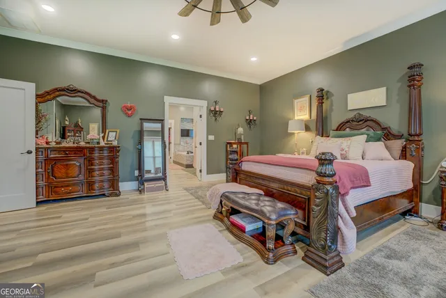 a kitchen with stainless steel appliances granite countertop a stove and a wooden floors