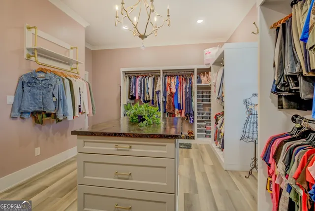 a living room with furniture a flat screen tv and a large window