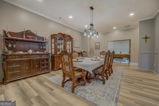 a view of a dining room with furniture and wooden floor