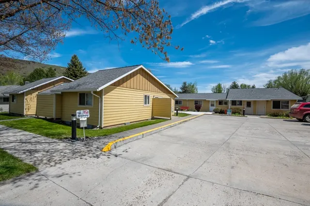 a front view of a house with yard