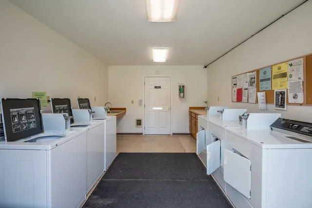 a view of kitchen with furniture and wooden floor