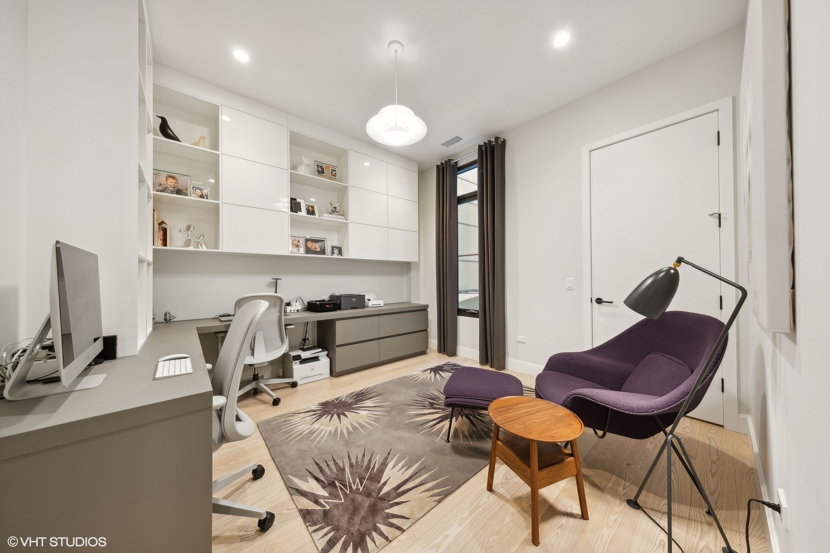 35 North Aberdeen Street, Unit 2S Chicago, IL 60607 - Photo 19 of 46 a kitchen with stainless steel appliances kitchen island granite countertop a sink and a refrigerator