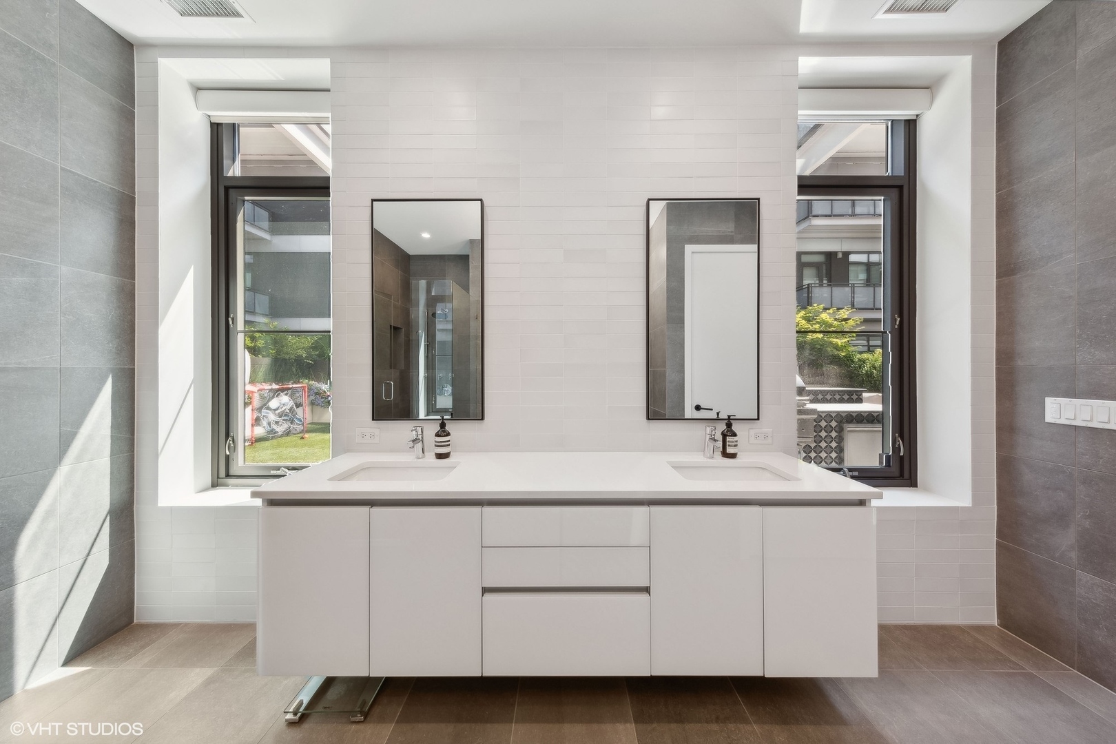 35 North Aberdeen Street, Unit 2S Chicago, IL 60607 - Photo 29 of 46 a bathroom with double vanity and a mirror