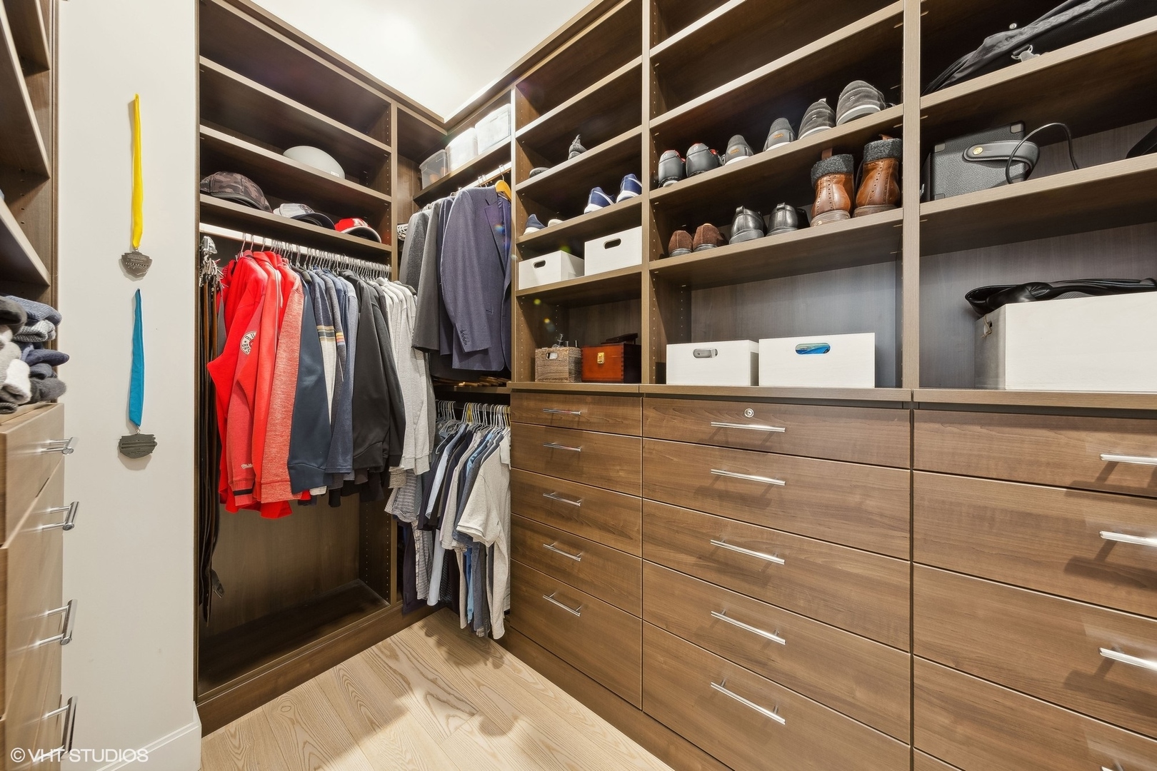 35 North Aberdeen Street, Unit 2S Chicago, IL 60607 - Photo 31 of 46 a view of walk in closet with clothes and shoes