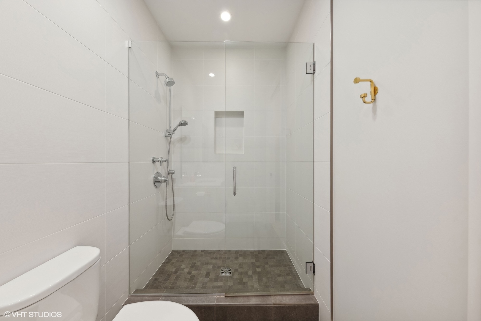 35 North Aberdeen Street, Unit 2S Chicago, IL 60607 - Photo 35 of 46 a bathroom with a shower and a toilet