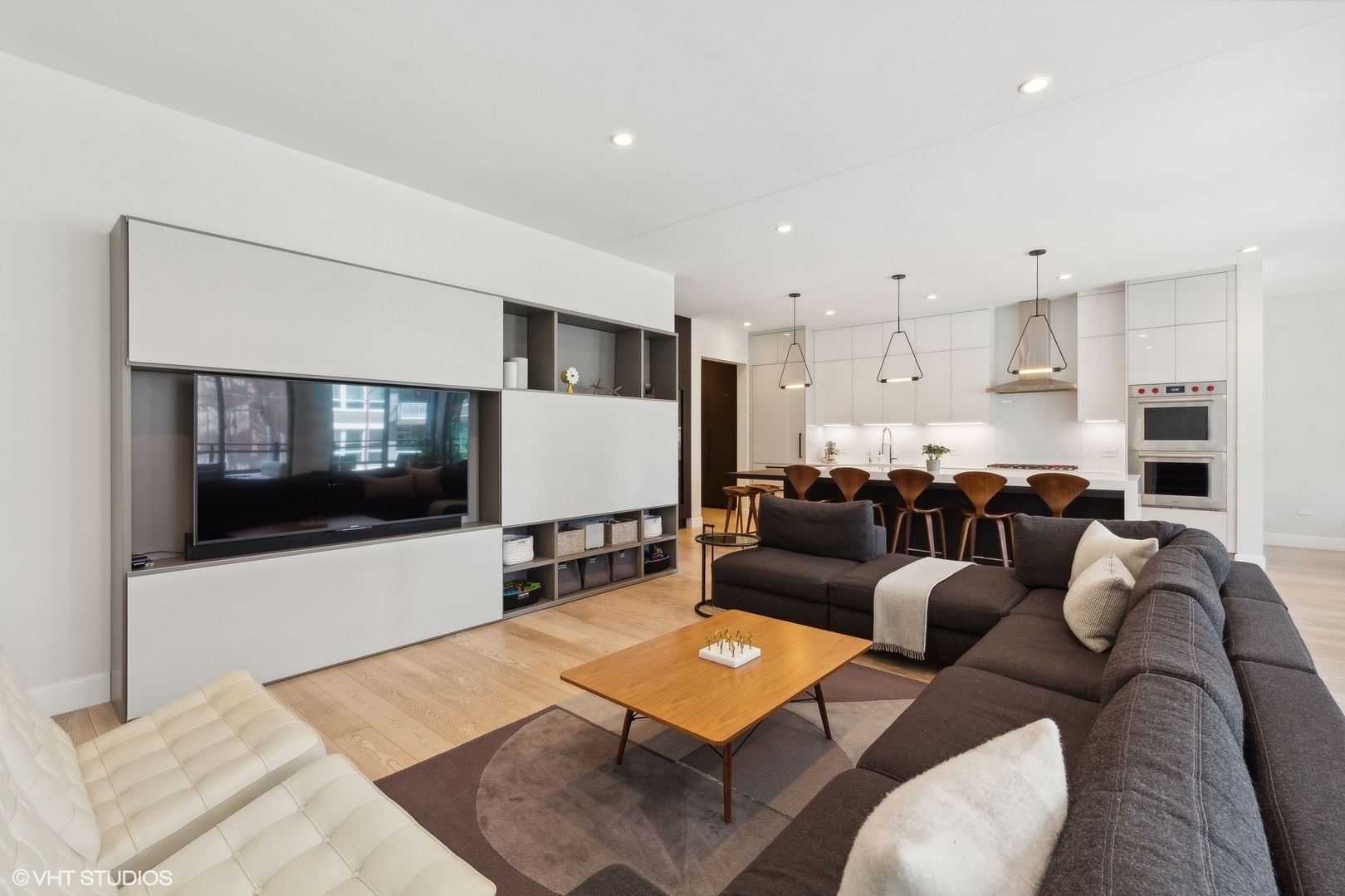 35 North Aberdeen Street, Unit 2S Chicago, IL 60607 - Photo 4 of 46 a living room with furniture and a flat screen tv