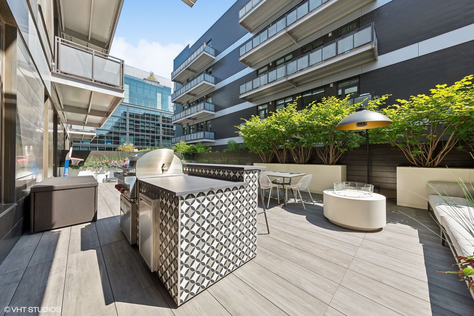 35 North Aberdeen Street, Unit 2S Chicago, IL 60607 - Photo 44 of 46 a roof deck with couches and potted plants