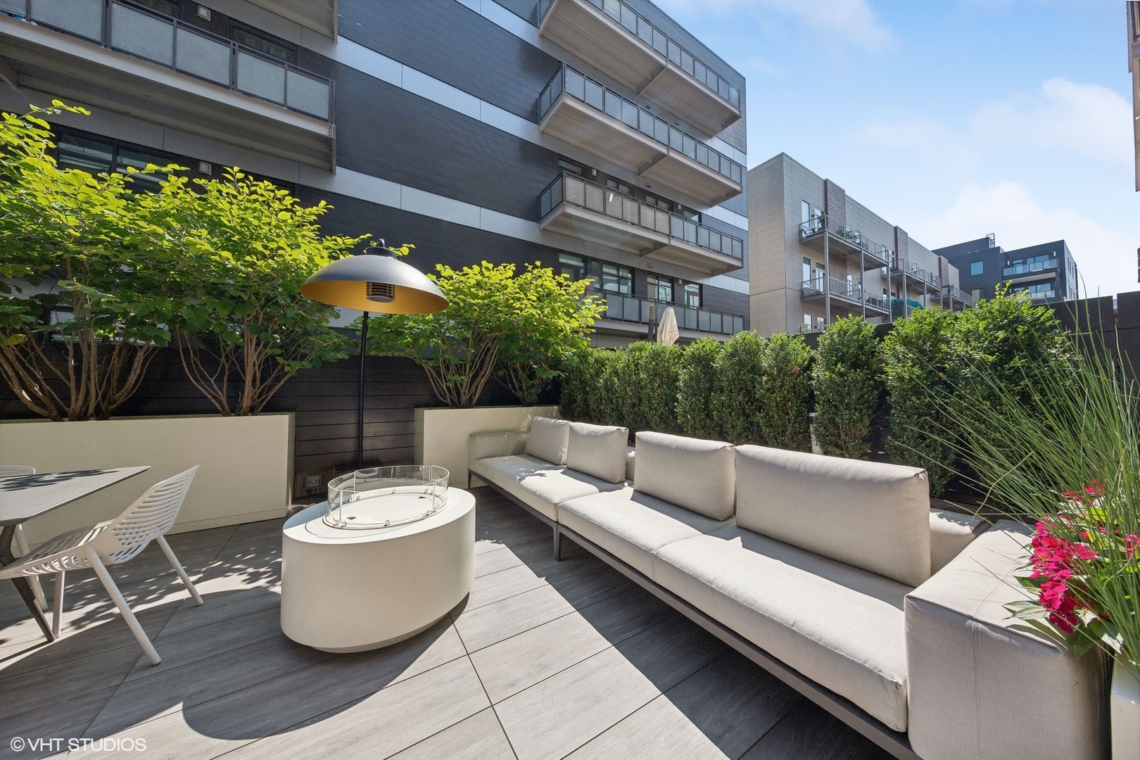 35 North Aberdeen Street, Unit 2S Chicago, IL 60607 - Photo 45 of 46 a view of a patio with couches and potted plants