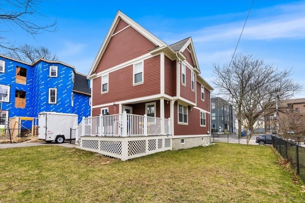 77 Cedar Street Boston, MA 02119 - Photo 24 of 25 a view of a house with a yard