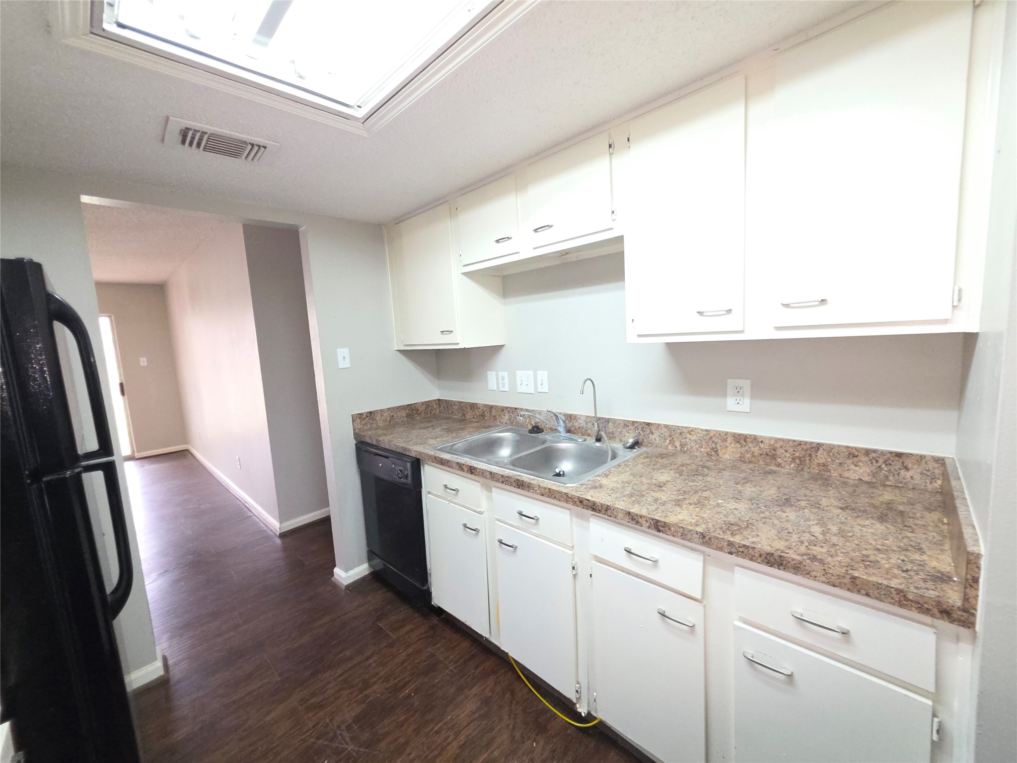 9814 Kiwi Lane Conroe, TX 77385 - Photo 3 of 13 a kitchen with stainless steel appliances granite countertop a sink a refrigerator and a stove