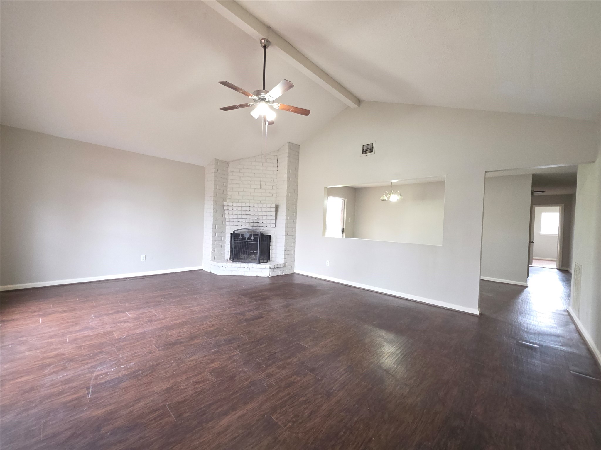 9814 Kiwi Lane Conroe, TX 77385 - Photo 5 of 13 wooden floor in an empty room with a window