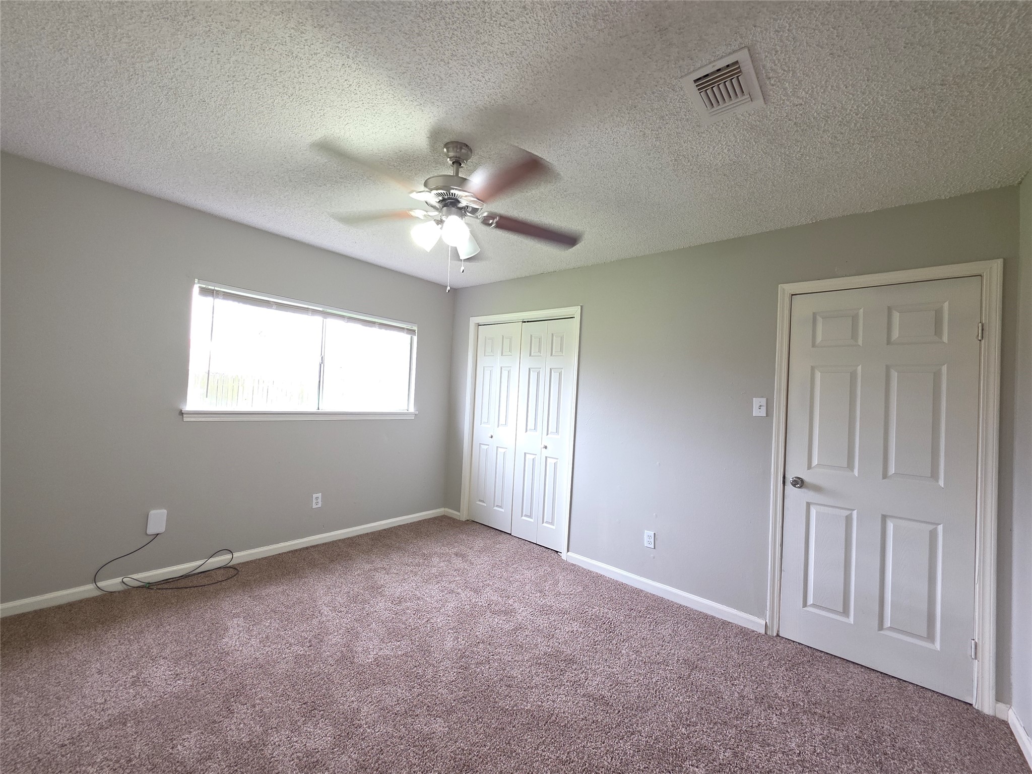 9814 Kiwi Lane Conroe, TX 77385 - Photo 9 of 13 a view of an empty room with a window