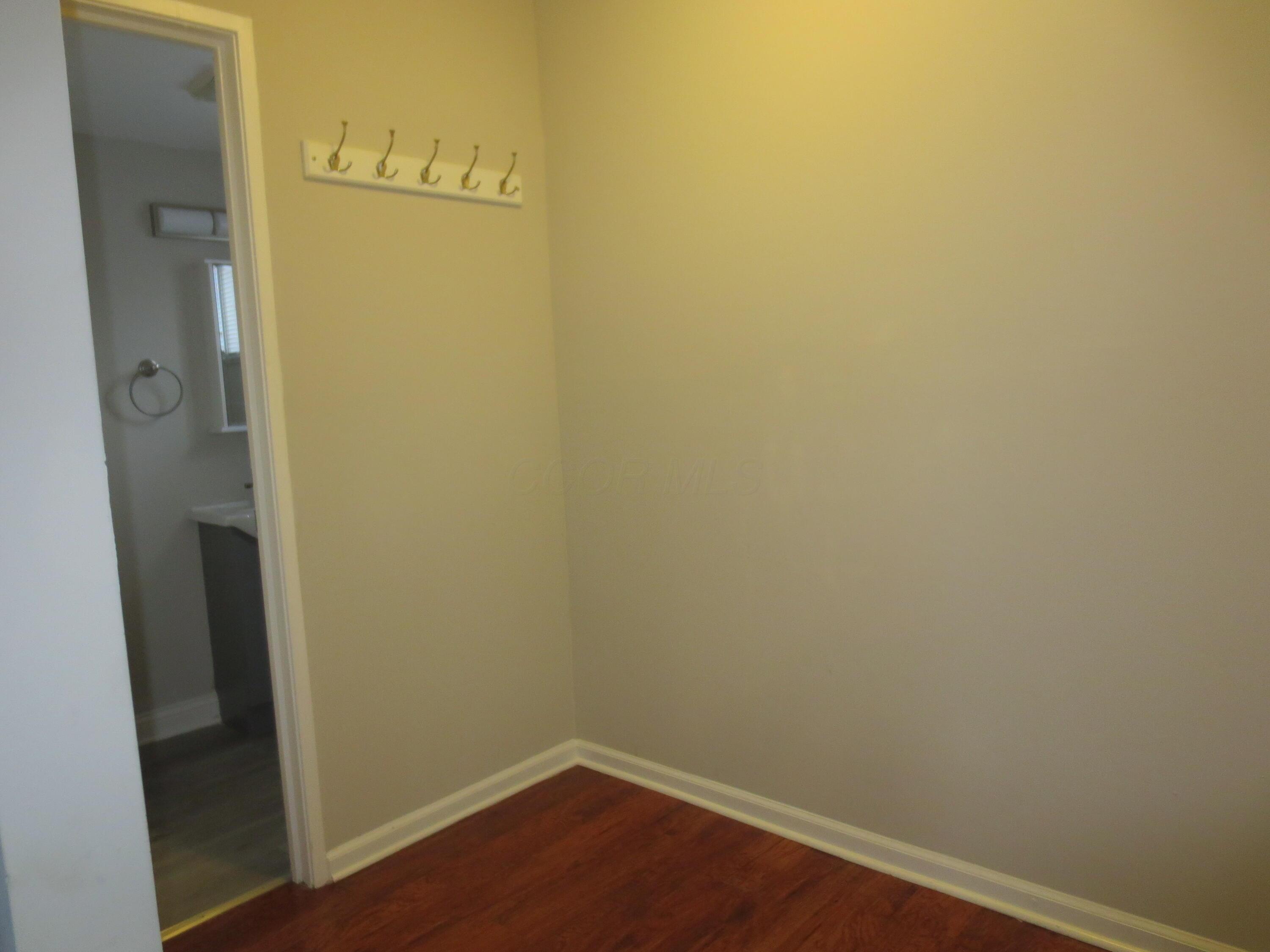 2663 Arcola Road Columbus, OH 43207 - Photo 9 of 21 Main floor closet area with clothes hooks for coats.