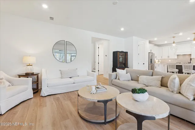a living room with fireplace furniture and a flat screen tv