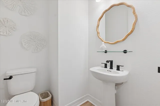 a bedroom with a bed and a chair