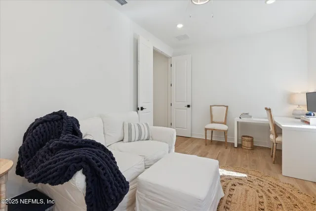 a bed sitting in a room next to a window