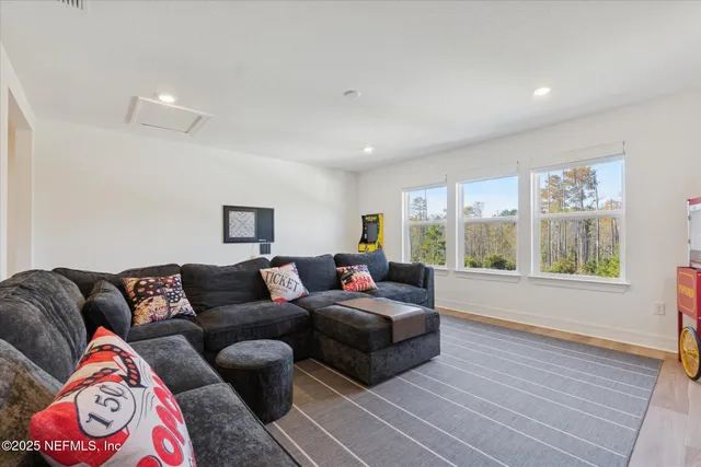 a bedroom with a bed and a chair